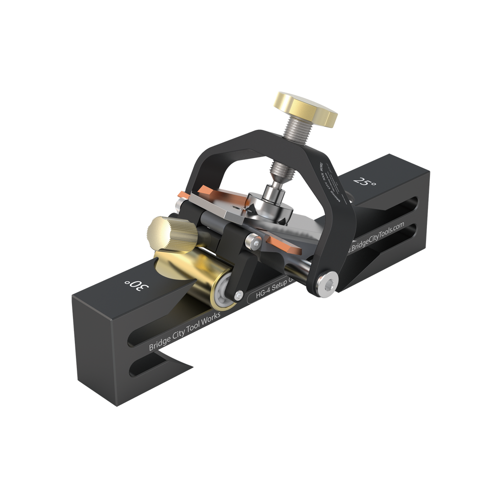 A black HG-4 Honing Guide designed for sharpening irons and chisels, featuring a solid brass roller and stainless steel hardware.